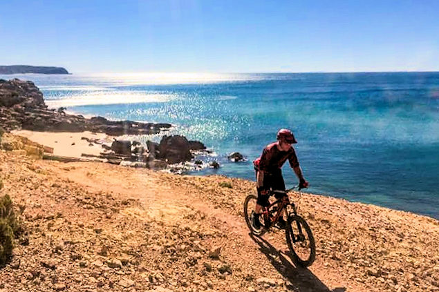 A Mountain Biker cycling along the Algarve coast