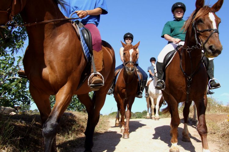 AltaVista guests enjoying horse riding near to Luz, Lagos