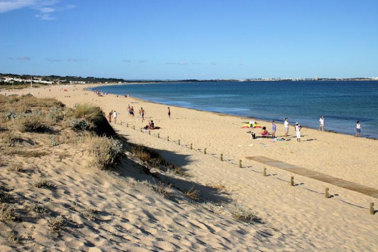 The long expanse of golden sand and extensive sand dunes make Meia Praia great for families