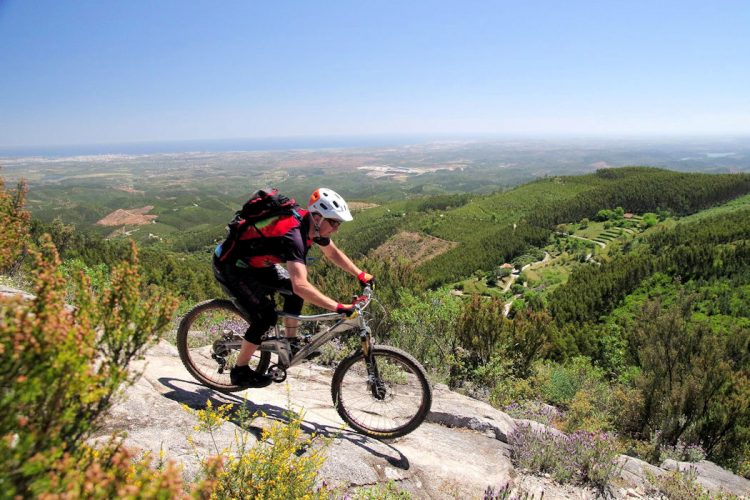 A happy guest cycling in the Costa Vicentina National Park