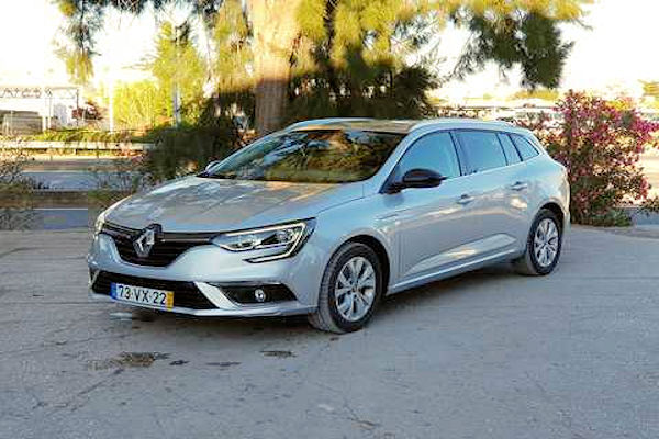 An automatic silver Renault Megane sitting on the driveway at Zitauto