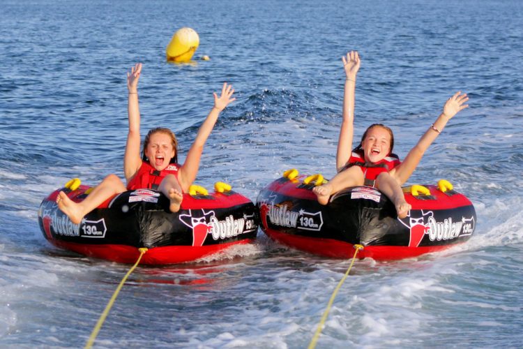 Beach Watersports (16) joyous friends on a ringo boat ride near to Luz Beach, Lagos