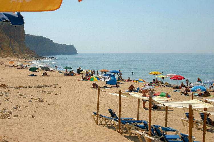 Porto do Mos has a large golden sandy expanse of sand as well as tall cliffs that provide some shade from the summer sun