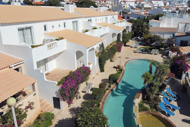 An aerial shot of the villas, apartments and swimming pool on the terrace of Ocean Villas Luz