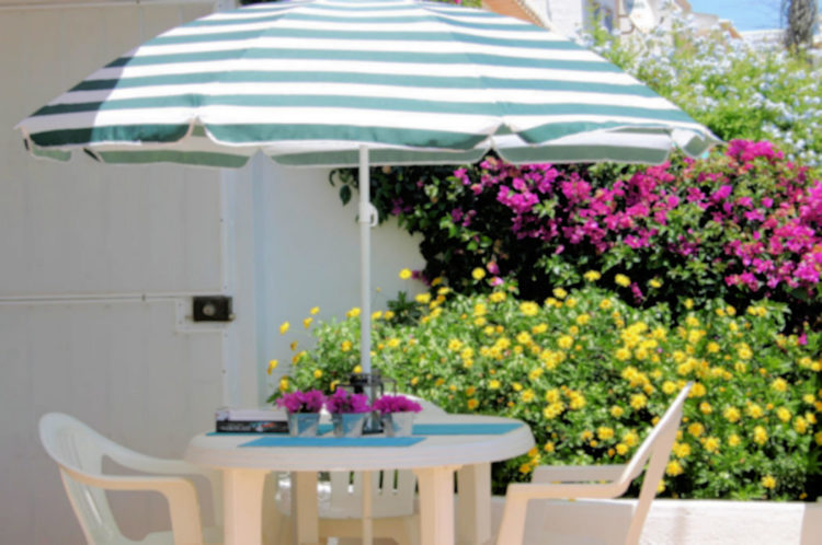 The terrace on the two bedroom villas is extremely large and has room for a table and chairs and extensive floral gardens